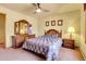 Comfortable bedroom with a decorative bed, matching dresser, and soft lighting at 4700 Homestead St, Bow Mar, CO 80123