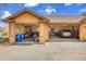 Attached two-car garage with extra tall ceilings and storage areas for projects and parking at 4700 Homestead St, Bow Mar, CO 80123