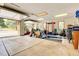 Spacious garage featuring tall ceilings and ample storage with an open garage door at 4700 Homestead St, Bow Mar, CO 80123