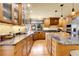 Spacious kitchen features custom cabinetry, granite countertops, and stainless steel appliances at 4700 Homestead St, Bow Mar, CO 80123