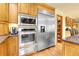 This kitchen has stainless steel appliances, including a built-in microwave and refrigerator at 4700 Homestead St, Bow Mar, CO 80123