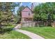 Exterior view of property with path winding through lawn and privacy fence creating private outdoor space at 12059 E Hoye Dr, Aurora, CO 80012