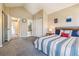 Bedroom with vaulted ceiling, carpet, and ensuite bathroom access at 12059 E Hoye Dr, Aurora, CO 80012