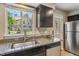 Kitchen featuring stainless steel appliances, granite countertops, and ample natural light at 12059 E Hoye Dr, Aurora, CO 80012