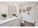 Bathroom with modern vanity, sleek fixtures, and a shower-tub combo, creating a serene and inviting space at 5873 Ceylon St # E, Denver, CO 80249