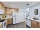 Well-equipped kitchen with modern appliances, ample counter space, and hardwood floors, perfect for cooking and entertaining at 5873 Ceylon St # E, Denver, CO 80249