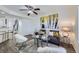 Cozy living room featuring a comfortable sofa, modern decor, and hardwood floors, perfect for relaxation at 5873 Ceylon St # E, Denver, CO 80249