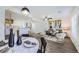 Open-concept living space with a modern dining area, comfortable seating, and sleek design, great for entertaining at 5873 Ceylon St # E, Denver, CO 80249