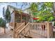 Backyard deck with string lights leading up to a screened porch at 6112 Alkire Ct, Arvada, CO 80004