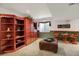 Finished basement features built in storage and ample recreation space with natural light at 6112 Alkire Ct, Arvada, CO 80004