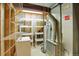Utility room with shelves, hot water heater and furnace in unfinished basement at 6112 Alkire Ct, Arvada, CO 80004
