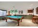 Finished basement with pool table, recessed lighting, and a comfortable seating area at 6112 Alkire Ct, Arvada, CO 80004
