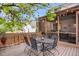 Wooden deck with seating and string lights along backyard at 6112 Alkire Ct, Arvada, CO 80004