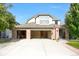 Spacious two-story home with brick facade, a three-car garage, and a well-maintained front lawn at 6112 Alkire Ct, Arvada, CO 80004