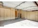 Spacious garage with ample storage cabinets and a clean, organized interior, perfect for parking and projects at 6112 Alkire Ct, Arvada, CO 80004