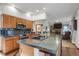 Spacious kitchen with granite countertops, stainless steel appliances, and an open layout at 6112 Alkire Ct, Arvada, CO 80004