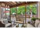 Enclosed porch with outdoor furniture and view of backyard deck at 6112 Alkire Ct, Arvada, CO 80004