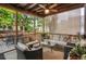 Enclosed porch with outdoor furniture and string lights overhead at 6112 Alkire Ct, Arvada, CO 80004