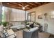 Enclosed porch with outdoor furniture and outdoor decor and ceiling fan at 6112 Alkire Ct, Arvada, CO 80004