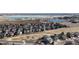 Panoramic aerial view of a neighborhood community, including lake views and a golf course in the foreground at 2238 Calais Dr # B, Longmont, CO 80504