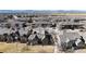 Wide aerial shot of a residential neighborhood featuring beautiful homes with mountain views in the background at 2238 Calais Dr # B, Longmont, CO 80504