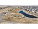 Scenic aerial view of a golf course with a pond and residential neighborhood at 2238 Calais Dr # B, Longmont, CO 80504