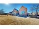 Grassy backyard with views of other units and blue sky at 2238 Calais Dr # B, Longmont, CO 80504