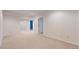Spacious finished basement with neutral carpeting and multiple doors leading to various rooms at 2238 Calais Dr # B, Longmont, CO 80504
