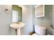 Well-lit powder room with a pedestal sink and classic fixtures at 2238 Calais Dr # B, Longmont, CO 80504