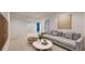 Bright living room featuring a modern sofa and stylish coffee table at 2238 Calais Dr # B, Longmont, CO 80504