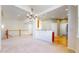 Bright and airy living room with hardwood and carpeted floors and staircase leading to upper level at 2238 Calais Dr # B, Longmont, CO 80504