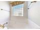 Bright bathroom showcasing a soaking tub, glass block window, and modern fixtures at 2238 Calais Dr # B, Longmont, CO 80504