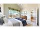 Relaxing main bedroom with a large window, vaulted ceilings and comfortable furnishings at 2238 Calais Dr # B, Longmont, CO 80504