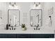 Elegant bathroom with double vanity, sleek black faucets, and decorative wall art at 4511 Tabor St, Wheat Ridge, CO 80033