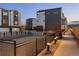 Community sand volleyball court surrounded by modern townhomes and exterior lighting at 4511 Tabor St, Wheat Ridge, CO 80033