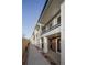 Exterior view of modern townhomes with brick accents and covered balconies at 4511 Tabor St, Wheat Ridge, CO 80033