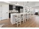 Contemporary kitchen with a quartz island, sleek appliances, pendant lights, and counter seating at 4511 Tabor St, Wheat Ridge, CO 80033