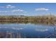 Scenic view of lake with tree lined shore and clouds reflecting in the water at 4511 Tabor St, Wheat Ridge, CO 80033