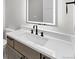 Bathroom featuring a modern floating vanity, quartz countertop, and black hardware fixtures at 1306 Yates St, Denver, CO 80204