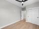 Neutral bedroom with hardwood floors, closet, ceiling fan, and white trim at 1306 Yates St, Denver, CO 80204