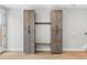 Built-in mudroom with storage cabinets, bench seating, and coat hooks adjacent to the home's entry at 1306 Yates St, Denver, CO 80204