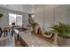 Kitchen island with granite countertop, stainless steel sink, and dining area views at 13079 E 103Rd Pl, Commerce City, CO 80022