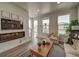 Inviting living room with contemporary fireplace and decor, filled with natural light at 13079 E 103Rd Pl, Commerce City, CO 80022