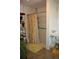 Functional bathroom with a stand-up shower and organized storage shelves at 5095 Grant St, Denver, CO 80216
