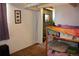 Bedroom featuring a fun bunk bed with basketball hoop, neutral walls, and comfortable carpeting at 5095 Grant St, Denver, CO 80216