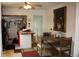 A cozy dining room with a wooden table, upholstered chairs, and decorative artwork at 5095 Grant St, Denver, CO 80216