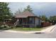 Charming single-story home with appealing exterior, landscaped yard, and corner lot location at 5095 Grant St, Denver, CO 80216