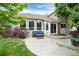 Charming backyard patio with concrete and blue outdoor furniture at 11056 W Rowland Ave, Littleton, CO 80127