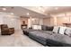 Spacious basement area with a cozy seating area, perfect for relaxing and entertaining guests at 11056 W Rowland Ave, Littleton, CO 80127