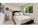 Bedroom showcasing a well-lit room and a large window at 11056 W Rowland Ave, Littleton, CO 80127